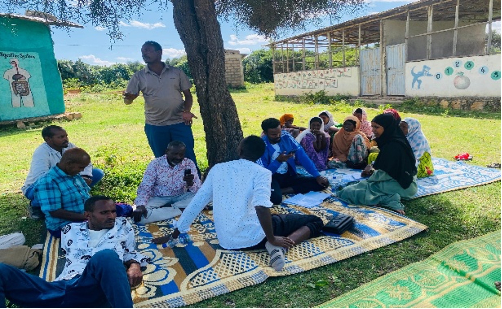 SRS leadership and stakeholders in a formal planning meeting with Ethiopian flag